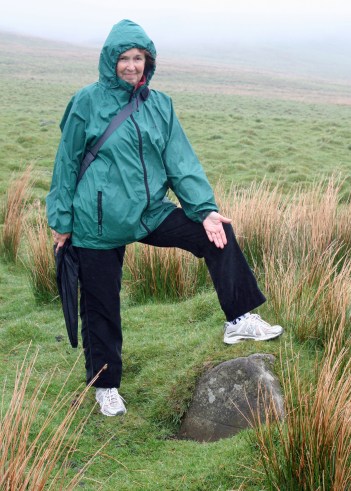 Peggy stands near where John Brown was shot on the likely remains of his house. Mist covers the distance as it would have on the day he was captured.