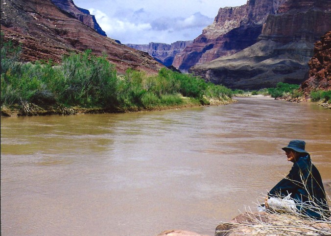 I am sitting on the edge of the Colorado, red with mud. (Peggy took this and the following photos when I returned down the Tanner Trail into the Grand Canyon several years later. I didn't have a camera on my first trip.)