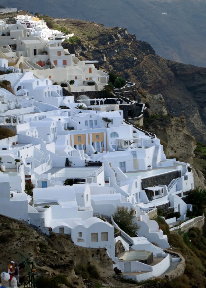 Another view of the town that provides a perspective on how it clings to the cliff. The whitewashed buildings reflect heat from the intense summer sun.