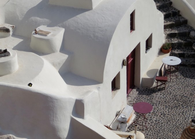 The rounded roof of this home is typical. Once these homes provided housing for poor sailors. Now they provide housing for millionaires. Another note on these downward trending homes. One person's patio becomes another person's roof.
