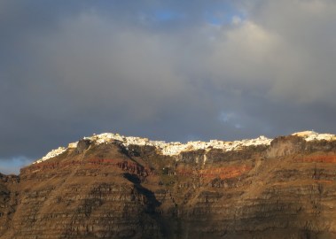 As we returned to our ship, which was anchored above the bulging lava chamber, we had a final look at the towering cliffs of Santorini and their beautiful white villages.