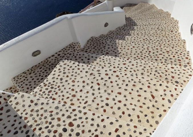 Another set of stairs with unique personality works its way down toward the Mediterranean in Oia, Santorini.