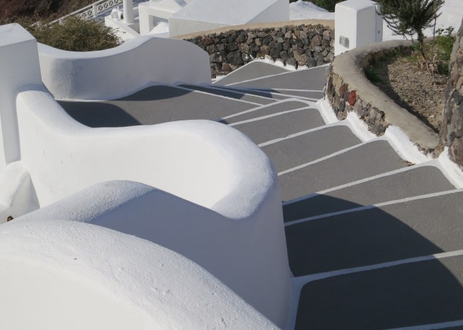 Stairways of all shapes and sizes went snaking down off the cliff in Oia, Santorini. This one was rather grand.