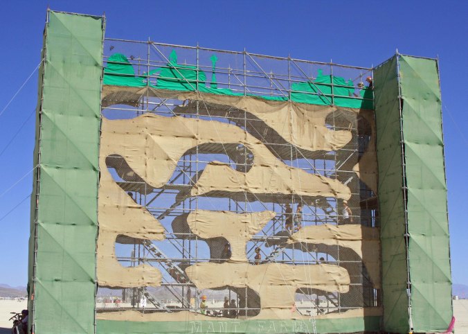 Much art is made to be interactive. Here, burners were invited to walk through the ant farm tunnels. The farm was at least 50 feet tall. Big Ants.