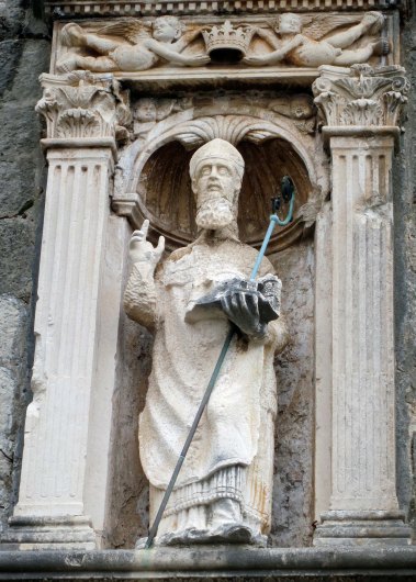 St. Blaise, the Patron Saint of Dubrovnik, holds a model of the city in his hand. This particular statue is found in the Pile Gate at one of the city's main entrances. (Photo by Peggy Mekemson)