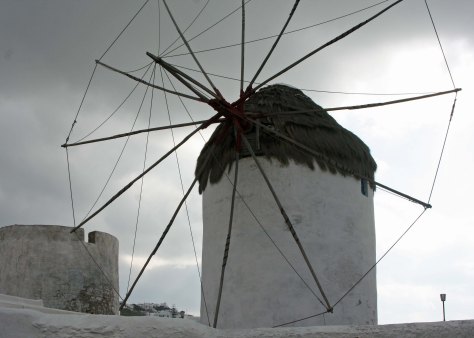 One of the windmills of Mykonos. Dark clouds brought brief rain and a "throw a chair" wind.