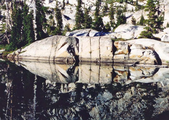 There are always delightful surprises waiting for you when you wander. I took this photo of Four Q lakes in the Desolation Wilderness near Lake Tahoe for its reflection. Only after the photo was processed did I see the mask.