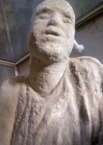 This body cast from Pompeii suggests to me that the person was gasping for breath.