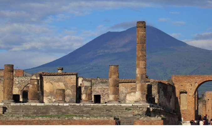 Mt. Vesuvius rises above the Temple of Jupiter in Pompeii.