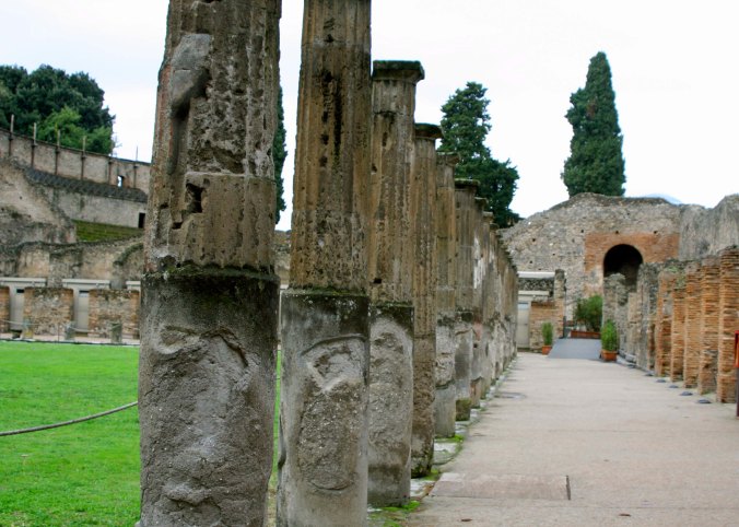 The clash of wooden weapons reverberated through the air as gladiators practiced on the field at the left. The hundred or so gladiators who trained at pompeii were housed in rooms on the right.
