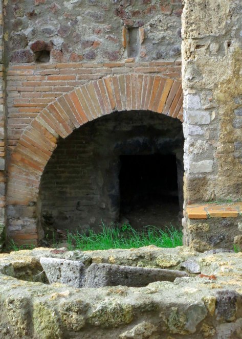 Large ovens such as this were used for baking bread. Can you smell it? The round object in front was used for grinding grain. Small rocks were included in the flour for free. I suspect dentists would be delighted.
