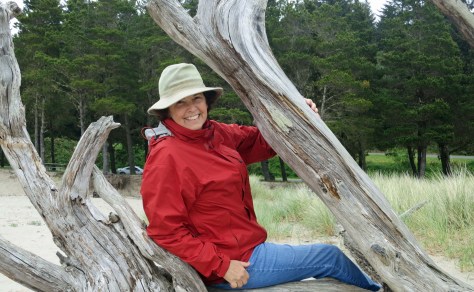 Peggy Mekemson and tree roots on Oregon Beach
