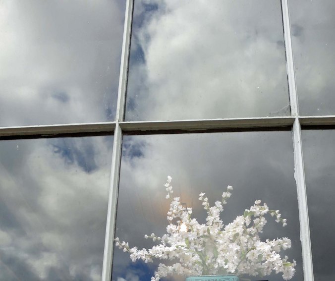 A window reflection photo in Jacksonville, Oregon.