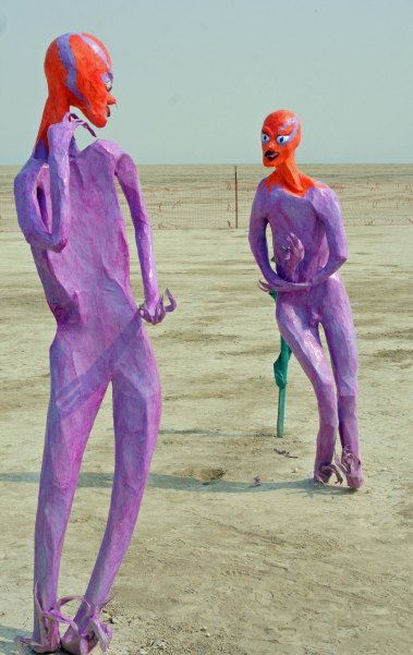 Two aliens in discussion at Burning Man 2013