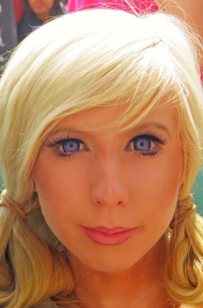 I was wandering through Center Camp when I came across this striking woman with her striking blue eyes, blond hair, and almost doll like features.