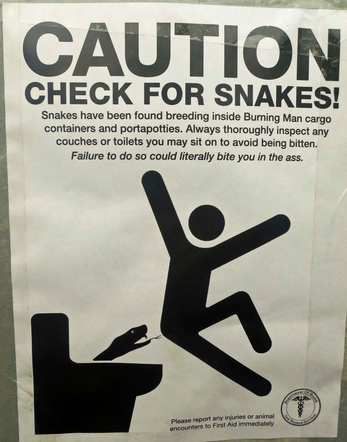 This sign warned Burners to be on the lookout for snakes that could be lurking down inside the potties.