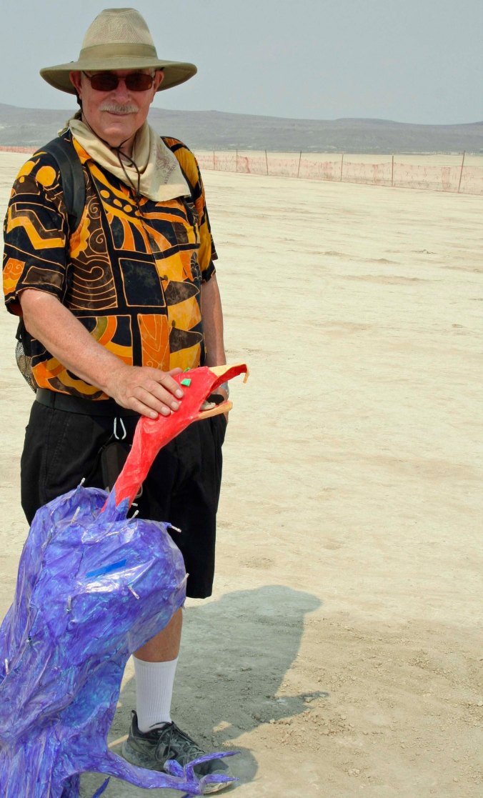Peggy caught this photo of me petting a vulture out near the fence on the edge of the Playa. Shortly afterward, I go in trouble with the law for climbing over the fence. But that's a story for another blog.