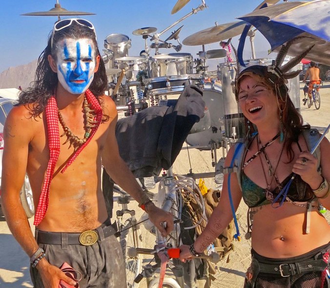 This couple from the band, Interstellar Transmissions, came walking by our camp dragging their drums behind them.