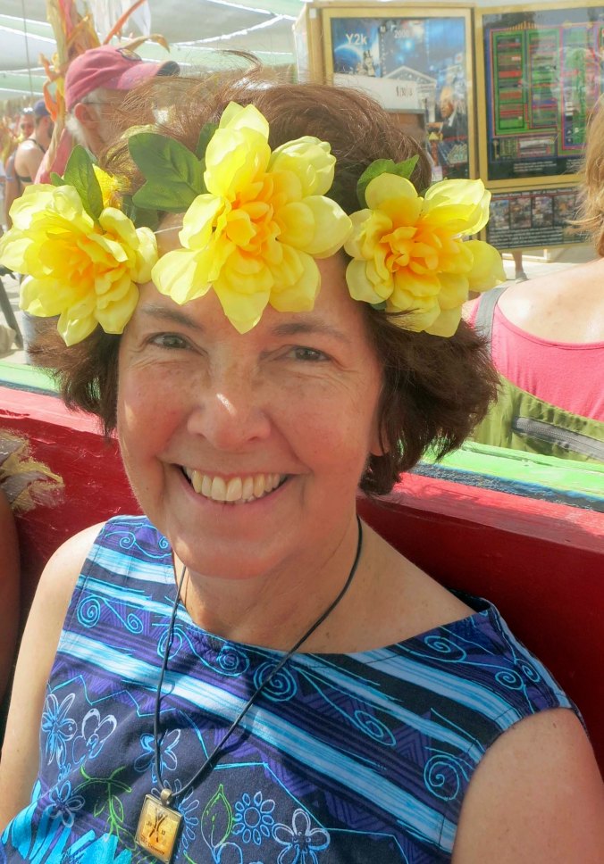 Not to leave you with an image of me patting a vulture, here's Peggy at Center Camp with flowers a floral head piece that had just been given to her.