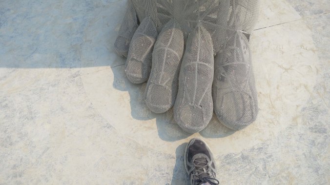 The toes of the sculpture Truth Is Beauty at Burning Man 2013.
