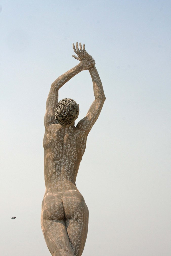 Art has become Burning Mans major attraction for many people, including me. This woman drew a constant crowd and I will devote a complete blog to her. BTW, is that a flying saucer on the left? (grin) (Photo by Peggy Mekemson.)