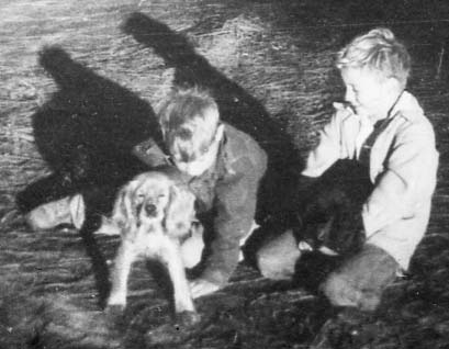 Marshall and I with the family dogs. I am on the left holding Happy. Marshall has Coalie.