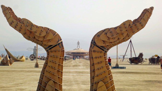 Open hands art piece in from of the Center Camp Cafe at Burning Man 2013.