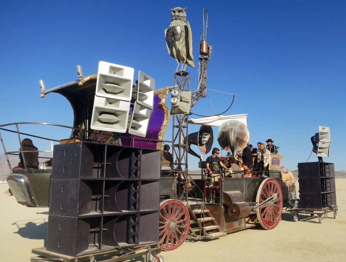 Mutant vehicle with a city of large speakers at Burning Man 2013.