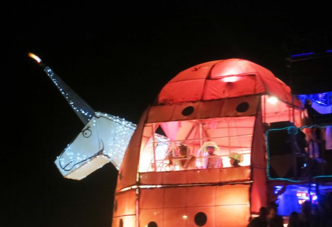 Unicorn mutant vehicle at night Burning Man 2013.