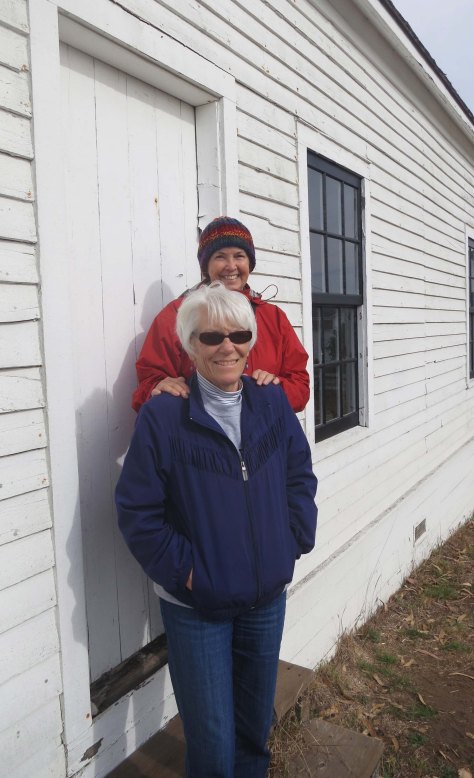 Photo of one-room school house at Pierce Ranch, Pt. Reyes National Seashore including Leslie Lake and Peggy Mekemson. Photo by Curtis Mekemson.