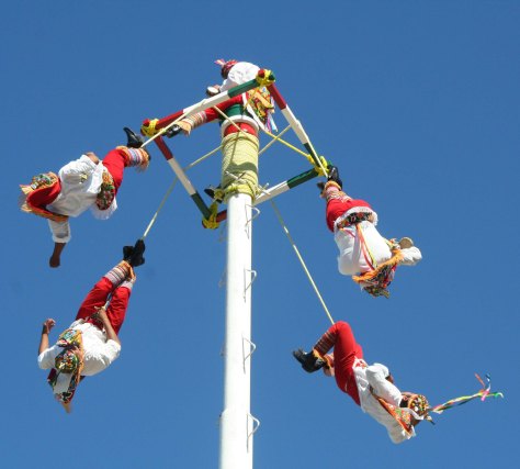 And then fall off backwards, twirling around the pole in ever larger circles until they reach the ground, or their rope runs out. (just kidding.) The people who perform this aerial feat every hour or so indigenous performers demonstrating an ancient cultural tradition of the Totonac tribe. (Photo by Peggy Mekemson.)