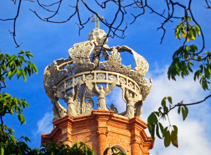 Photo of crown of the Church of Our Lady of Guadalupe in Puerto Vallarta,  Mexico. Photo by Curtis Mekemson.