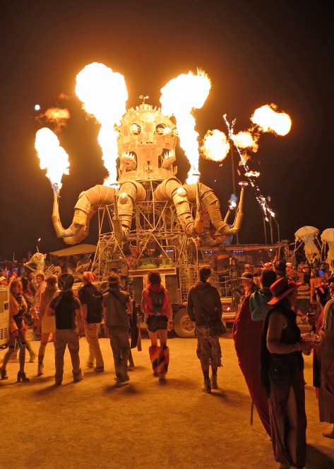Mutant vehicles work their way back and forth across the Playa. Many spout fire.