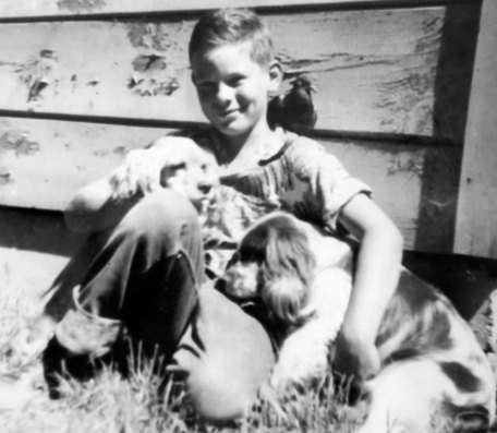 Photo of Curt Mekemson as a child with pets.
