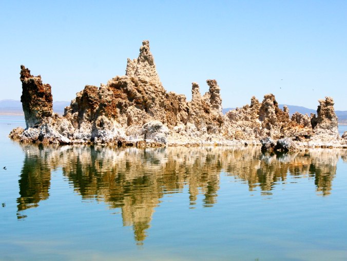 Reflections add extra character to this often photographed tufa island in Mono Lake. (Photo by Peggy Mekemson.)