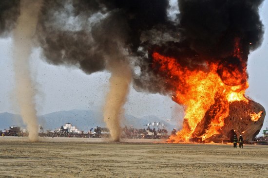 Flames are so intense that mini-tornadoes, large dust devils are created. (Photo by Peggy Mekemson.)
