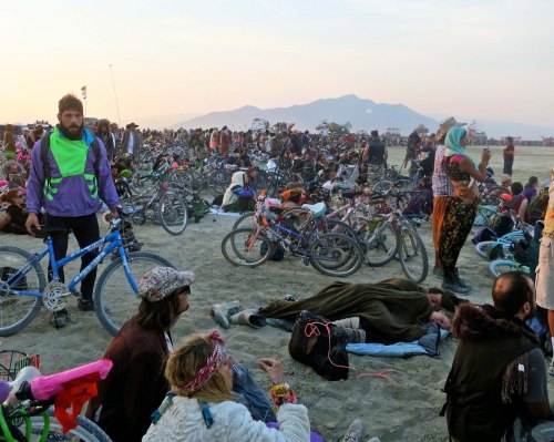 Crowd gathers to watch burning of Embrace the Dawn at Burning Man 2014. Photo by Curtis Mekemson.
