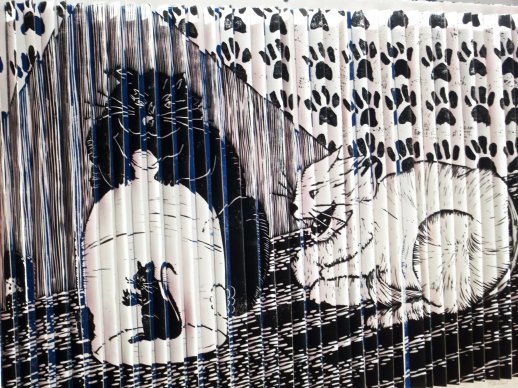 The two cats who have caught Grandpa Mouse, promise him his freedom if he reads them an amusing story.