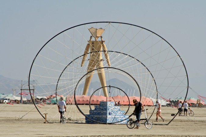 Geometric Sculpture and Man at Burning Man 2014. Photo by Curtis Mekemson.