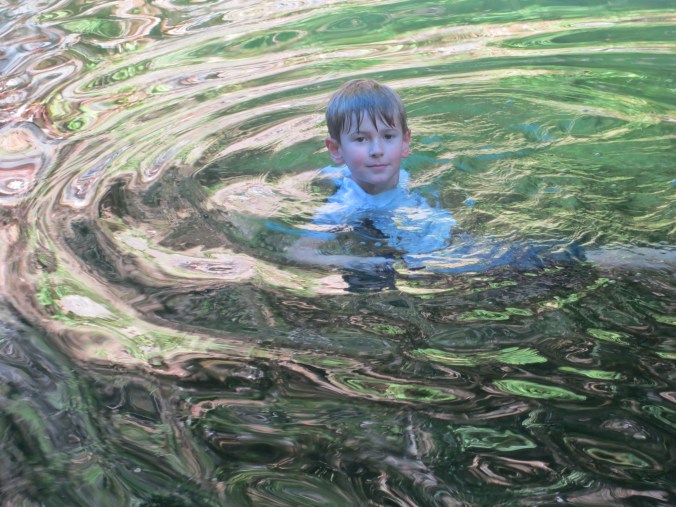 Our grandson Ethan enjoys a dip in the Applegate River this summer a few miles from our house .