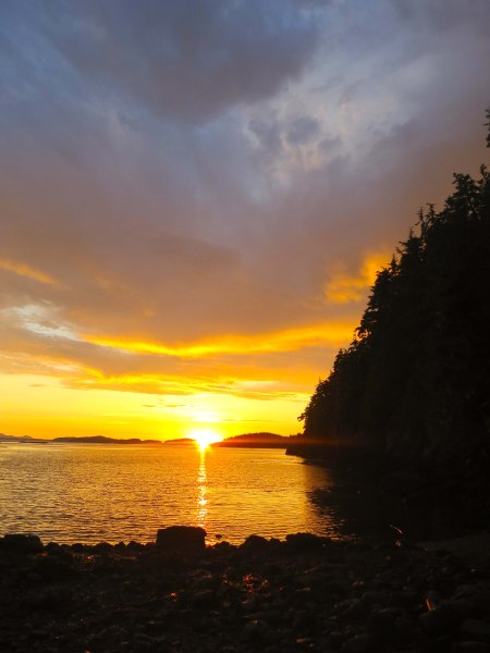 Sunset over Johnstone Striait off of Hanson Island. Photo by Curtis Mekemson.