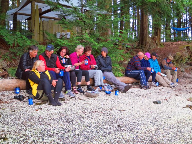 Sea Kayak Adventures group relaxes on beach at campsite on Compton Island, British Columbia.