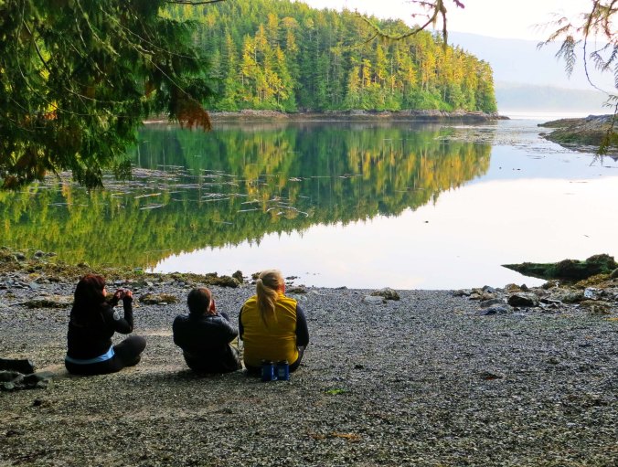 Members of our group enjoy a quiet moment at the end of the day, hoping for a whale to appear. Next blog: we kayak to Berry Island and hear a tale about Bigfoot. 