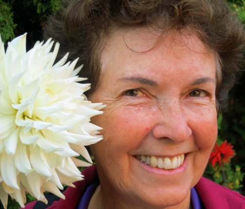 I'll conclude with a photo of  Peggy snuggling up to one of the flowers at the Albion Manor. Next Blog; I will return to our kayak adventure off of the northeast coast of Vancouver Island.