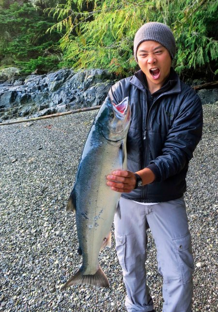 Sea Kayak Adventures guide reacts to wiggling salmon he thought was dead. 