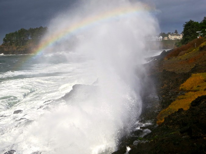 October: Rainbow caught in waves on Oregon Coast.