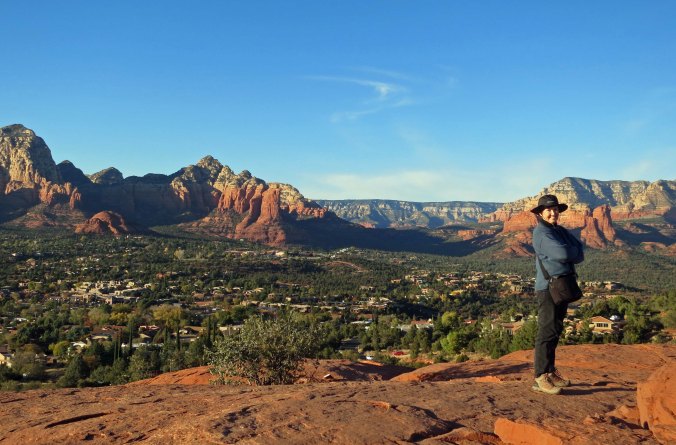 Peggy stands on top of the vortex located near the Sedona Airport. Sedona lies below, hemmed in by Red Rocks.