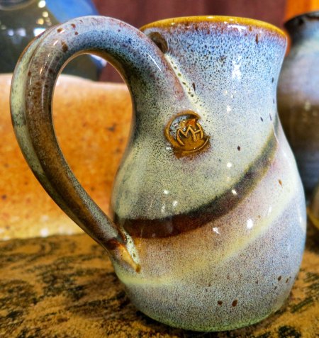 This coffee cup came home with me. The MH serves as Marian's signature.