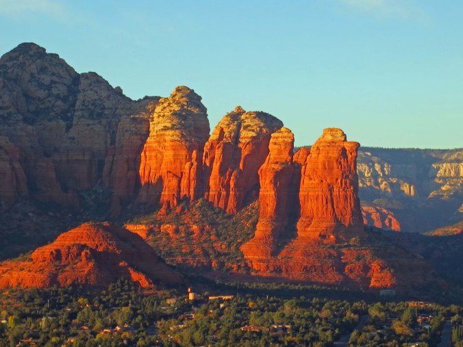 Coffee Pot and Sugar Loaf rock formations in Sedona, Arizona reflect the setting sun. Photo by Curtis Mekemson.