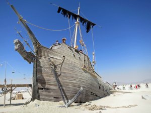 Burning Man pirate ship partially sunk in the sand and built at the Generator warehouse in Reno, Nevada.